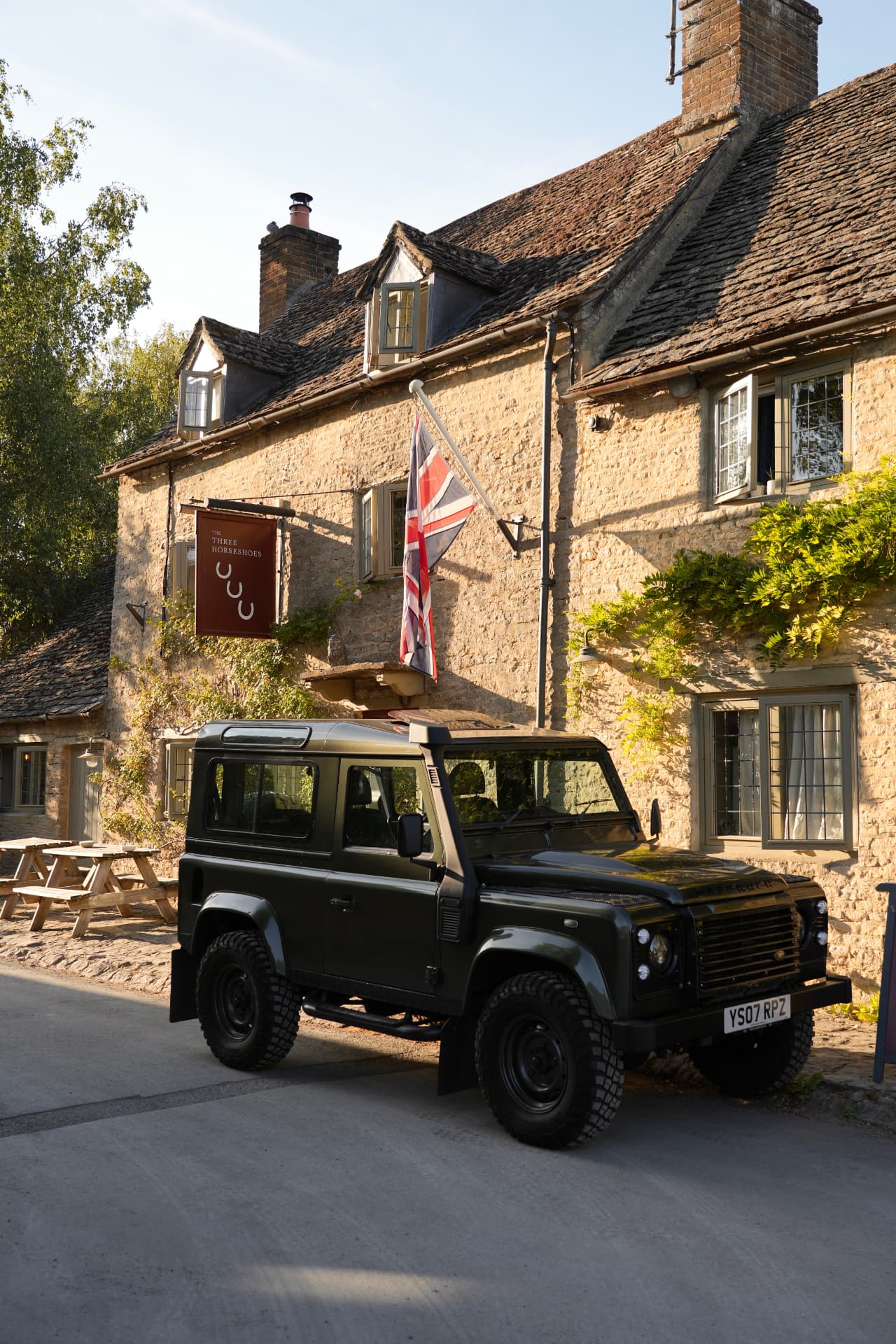 Land Rover Defender outside The Three Horseshoes in the Cotswolds