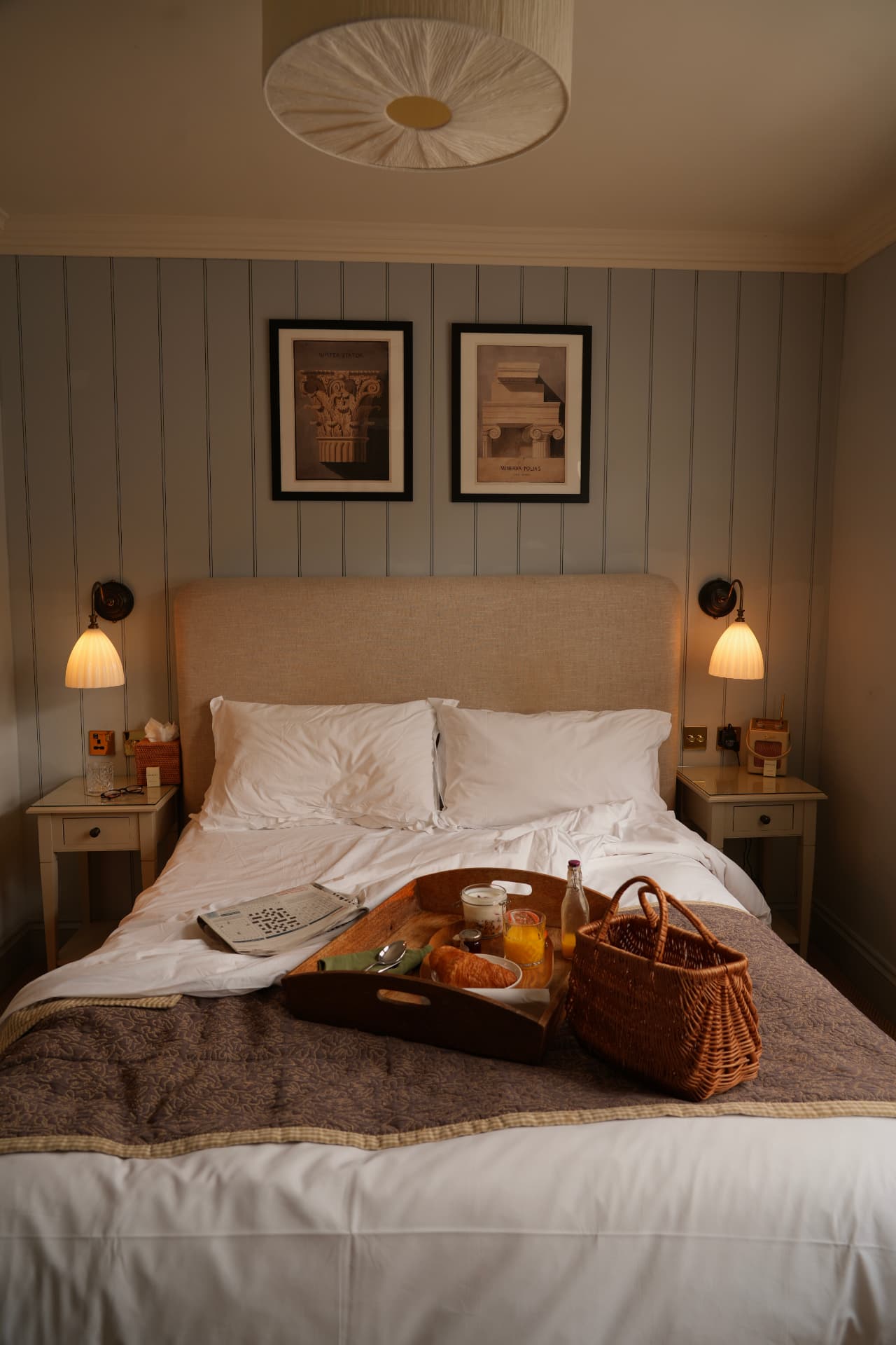 Warm guest bedroom with breakfast waiting on the bed